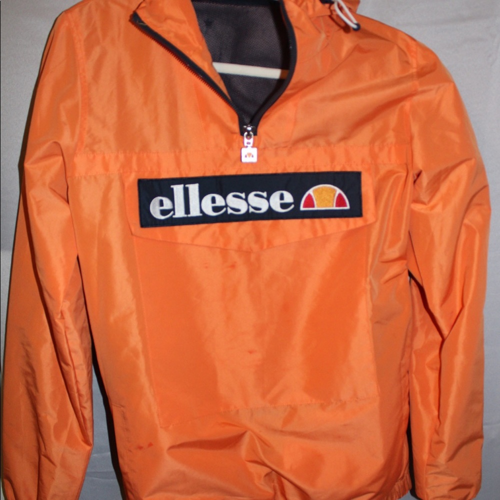 Bright orange/navy blue ellesse windbreaker